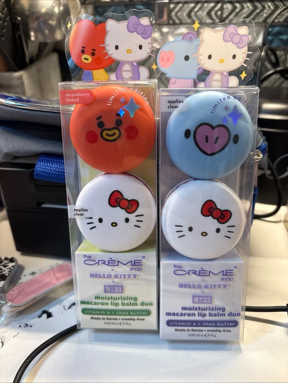 The Crème Shop Hello Kitty x BT21 Moisturizing Macaron Lip Balm Duo — Red & Blue
